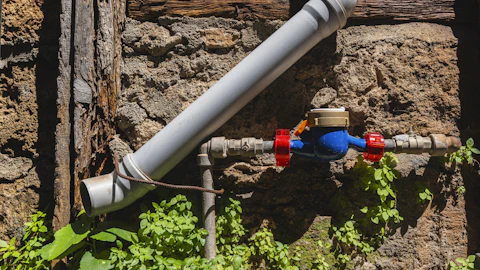 Water meter and supply pipe on an outside wall